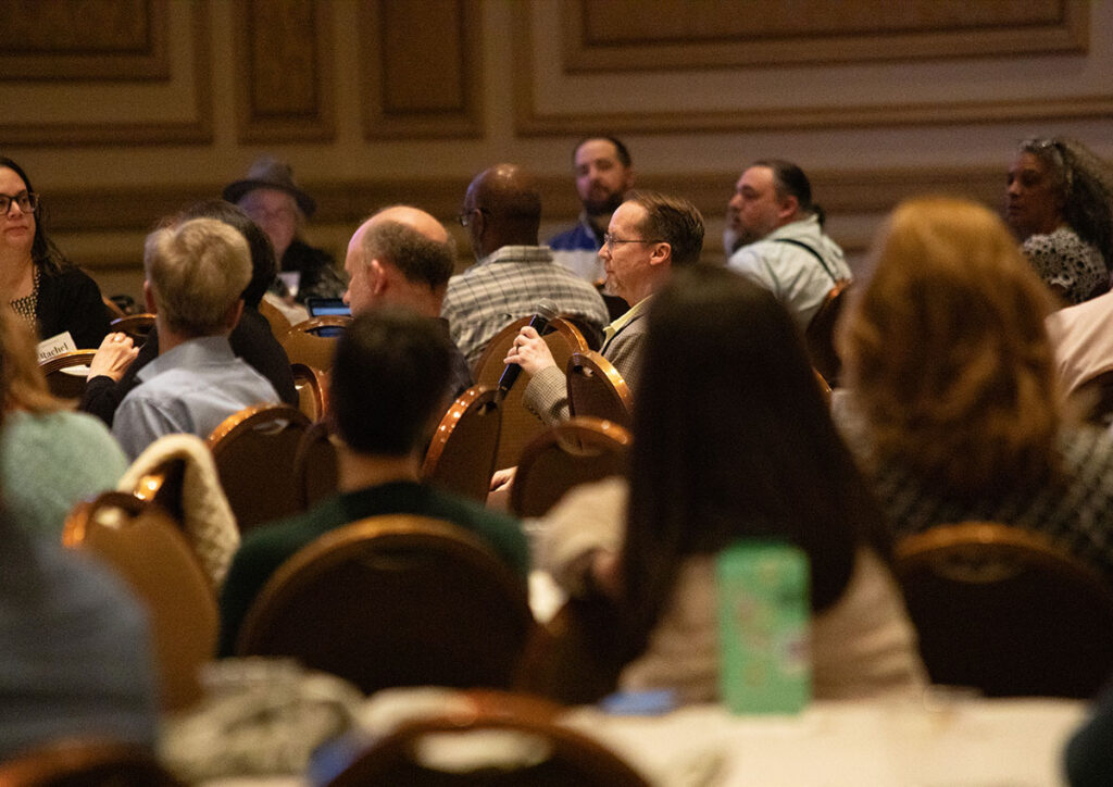 Attendees enjoying a question and answer portion of a presentation