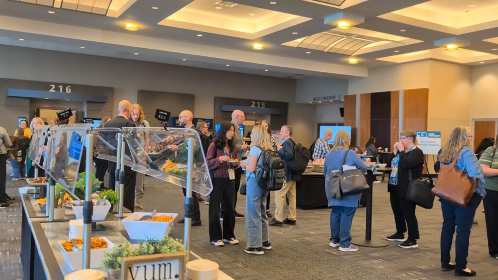 More mingling near the snack bar during Networking Breaks